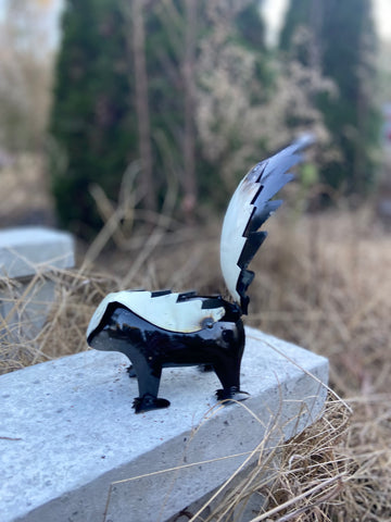 repurposed metal art skunk small