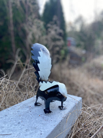 repurposed metal art skunk medium