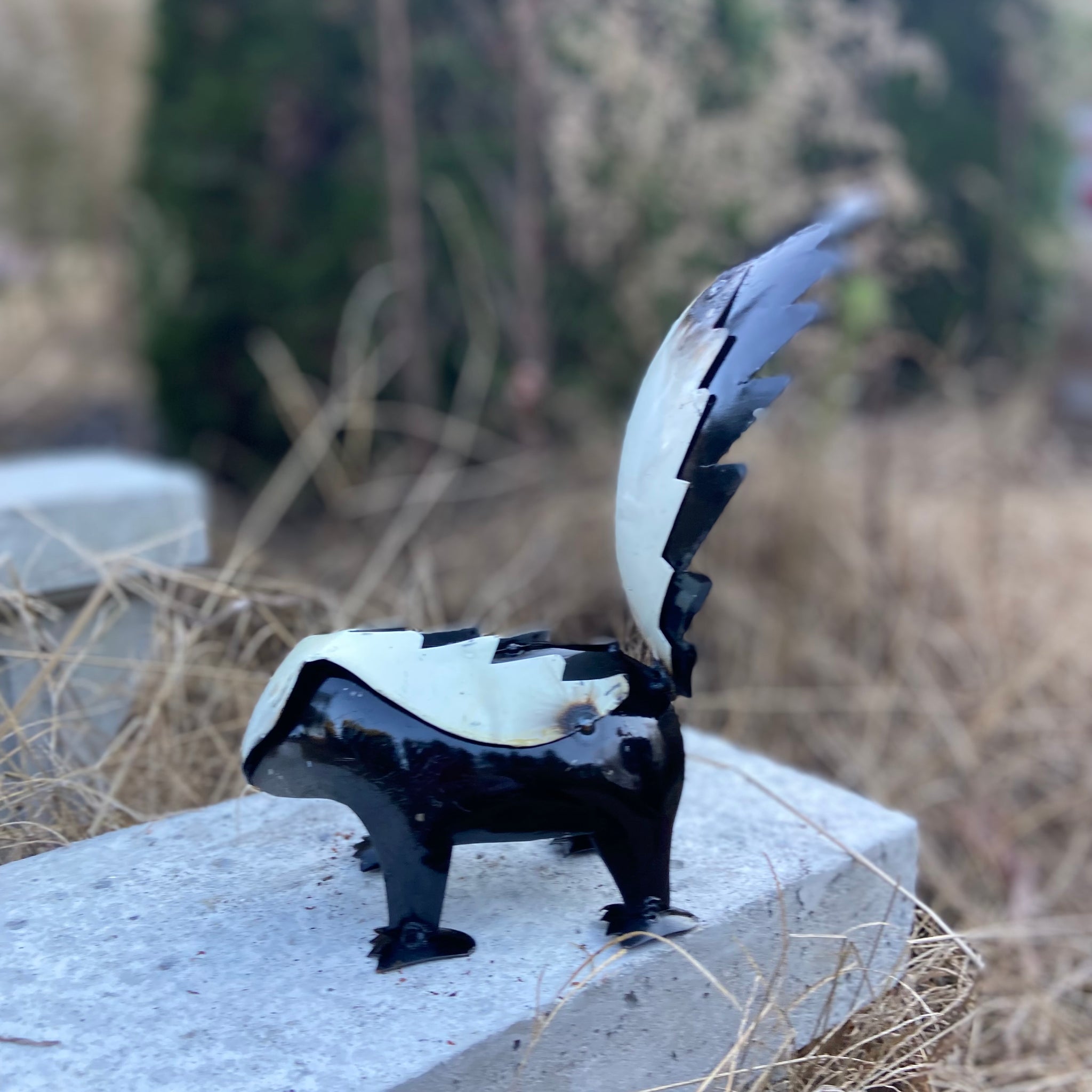 repurposed metal art skunk small