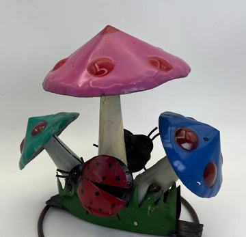 repurposed metal art mushroom with ladybug